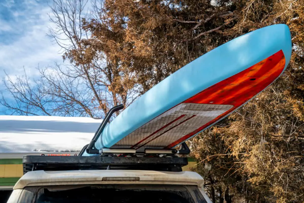 Paddle board on a rooftop vehicle rack