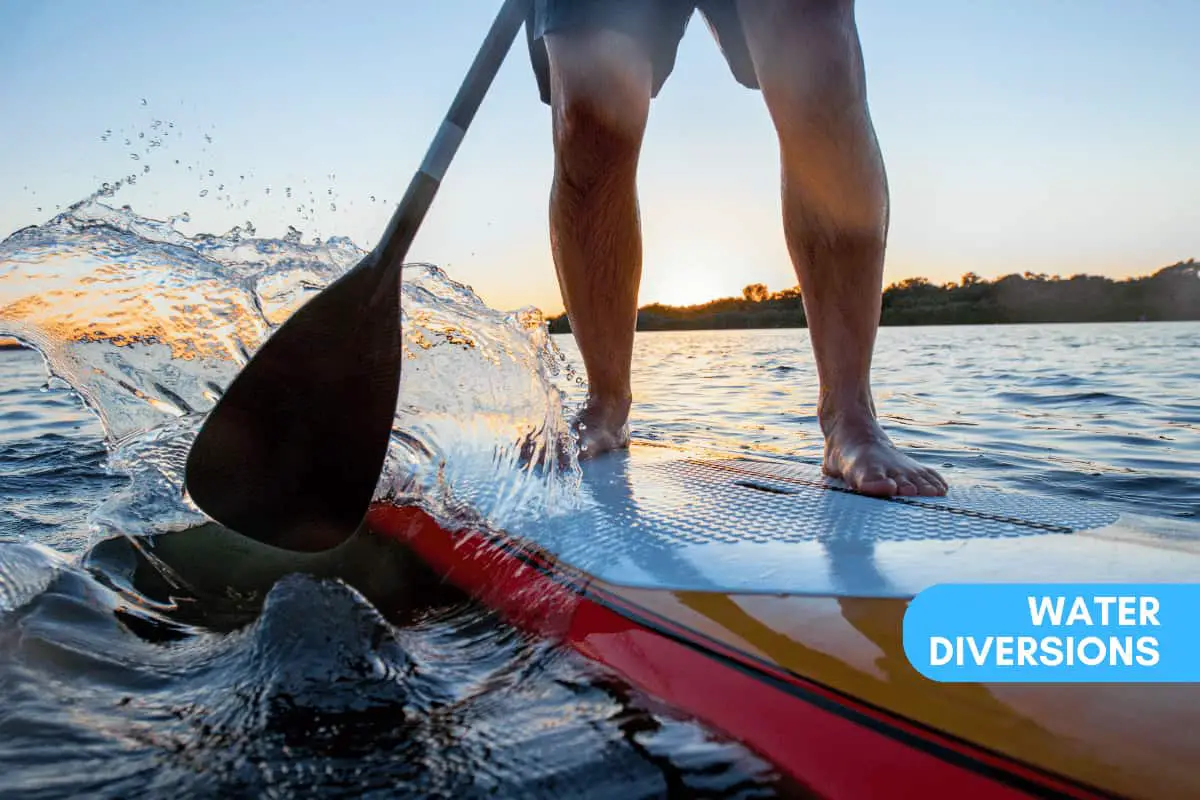 Man paddling on his board moving fast